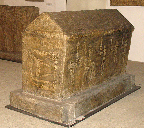 A Tombstone Showing a Bear Hunt and a Knightly Scene